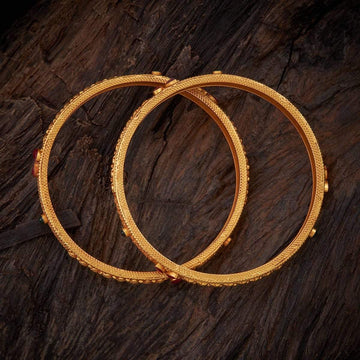 Bangles in Glossy Gold Tone with Rich Carvings & Spinal Stone